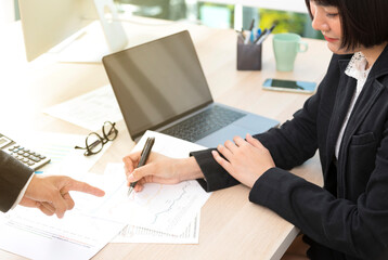 Hands of business people working at office. Businesswoman making a note. People, business and teamwork concept.