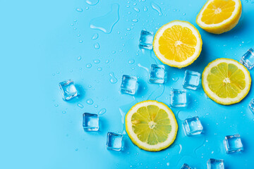 juicy fresh yellow lemon slices and ice cubes on a blue background. Top view, flat lay