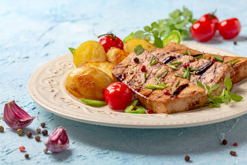 Grilled tofu steaks with potatoes.