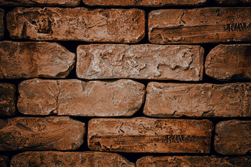 Brick wall close-up. Abstract red brick background with vignette