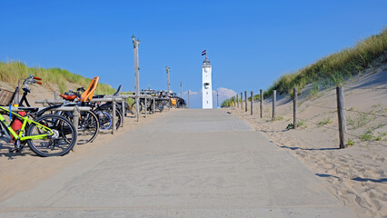 The lighthouse in Noordwijk aan Zee in front of the entrance to the beach in the Netherlands