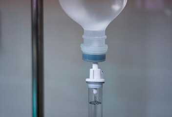 Close up Infusion bottle pump with saline solution drip and clipping path for patient admit room in hospital.