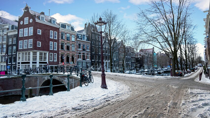 City scenic from a snowy Amsterdm in winter in the Netherlands