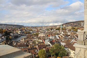 Fototapeta na wymiar A view from Grossmünster (Romanesque-style Protestant church) of Zurich Switzerland and Limmat river.