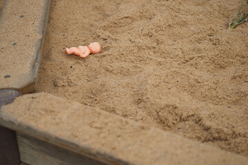 Children's toys in the sandbox in the summer outdoors. High quality photo