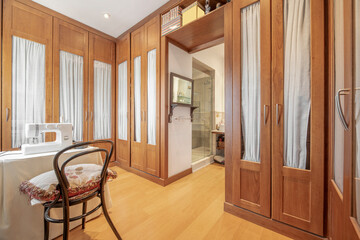 Room dedicated to dressing room with sewing box in the anteroom of the bathroom of a double bedroom