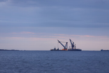 Fototapeta na wymiar Large crane ships at sea.