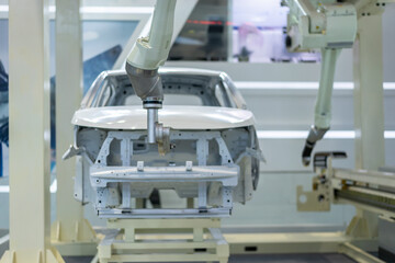 robot arm working in car factory