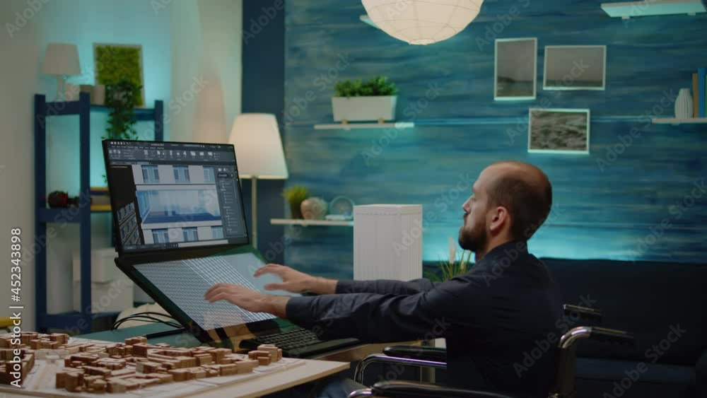 Poster disabled man working as architect with building model on touch screen monitor at office. engineer si