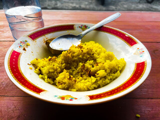 Yellow rice with mix vegetables, eggs, and mear