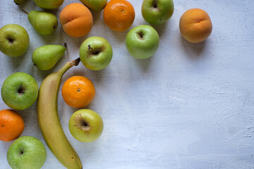 Assorted fruits on textured white