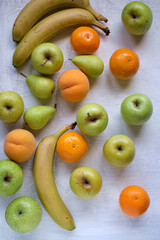 Assorted fruits on textured white