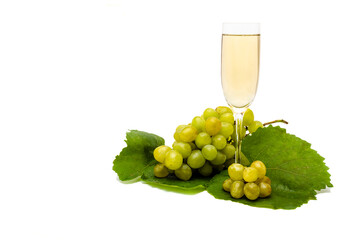 Glass with wine and grape cluster
