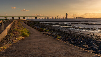 Golden Hour at the The Prince of Wales Bridge and the River Severn, seen from Redwick, South Gloucestershire, England, UK