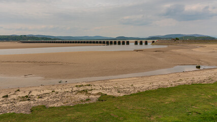 Looking at the railway bridge over the River Kent in Arnside, Cumbria, England, UK