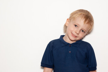 Cheerful little boy on a white background