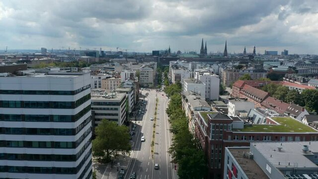 Ascending and tilt down footage of wide multilane road in urban neighbourhood. Free and Hanseatic City of Hamburg, Germany