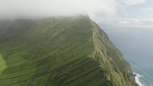 Aerial view of Caldeirao, a lake along the coastline on Corvo island, Azores islands, Portugal.