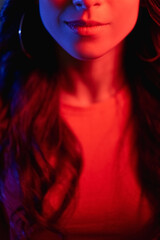 smiling woman neon light portrait face red color