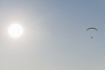 Paragliding flight in the air over the mountains.