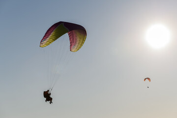 Paragliding flight in the air over the mountains.