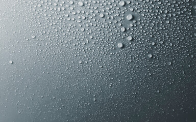 Water drops on smooth surface, blue grey  background