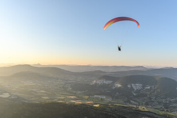 Paragliding flight in the air over the mountains.