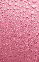 Water drops on smooth surface, pink background