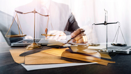 Business and lawyers discussing contract papers with brass scale on desk in office. Law, legal...