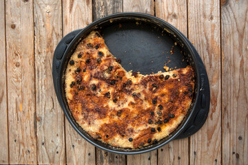 Just baked cake on wooden table 