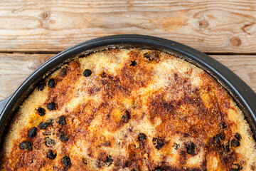 Just baked cake on wooden table 