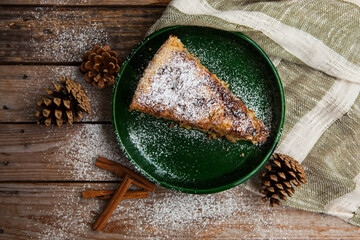 Tasty piece of pie on old wooden table