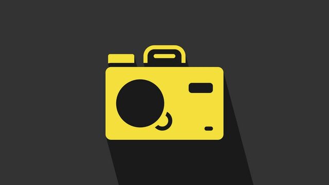 Yellow Photo camera icon isolated on grey background. Foto camera. Digital photography. 4K Video motion graphic animation