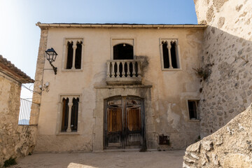 Fototapeta premium Old abandoned palace, medieval style, on a sunny afternoon. 