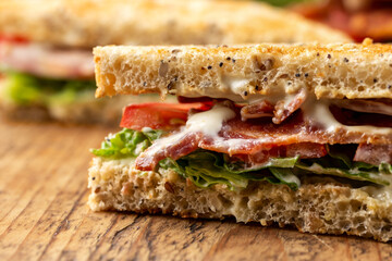 Fresh BLT Sandwich with Bacon Lettuce and Tomato on wooden board