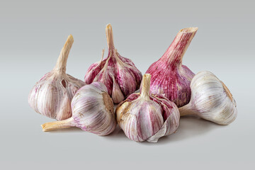 Few garlic heads on a light background