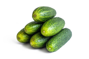 Stack of six ripe green cucumbers on a white background