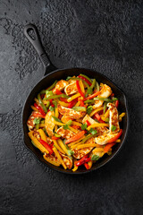 Tasty Halloumi cheese Fajitas with mix pepper in iron cast pan. Healthy food.