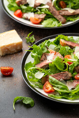 Italian Beef Tagliata salad with wild rocket, cherry tomatoes and parmesan cheese