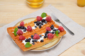 dessert fresh waffles with berries on a plate