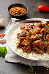Chinese traditional cuisine sticky braised pork belly with rice on white plate