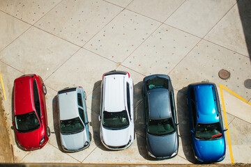 colorful image from the heights of parked cars showing some abstract perspective