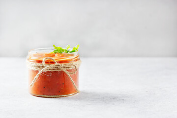 Authentic Spanish Sofrito sauce made with tomato, peppers, onion, garlic, herbs and olive oil in...