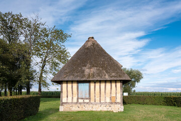 Fototapeta na wymiar half timbered old farm in french normandy under blue summer sky