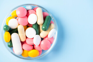 Many Colorful Pills and Tablets Medicine Drug on Copy Space Background