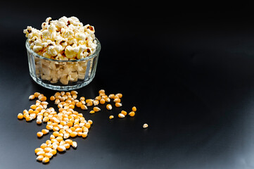 Raw corn and popcorn, ready to serve and eat