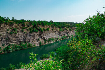 Canyon with blue water river in autumn. Selective focus.
