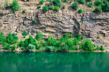 Canyon with blue water river in autumn. Selective focus.