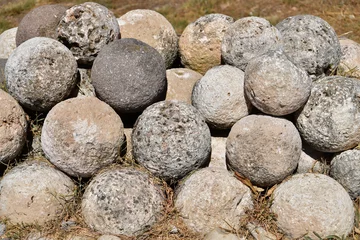 Fotobehang Ancient Stone Cannonballs © The Cheroke