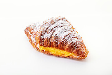 The croissant with cream in powdered sugar.